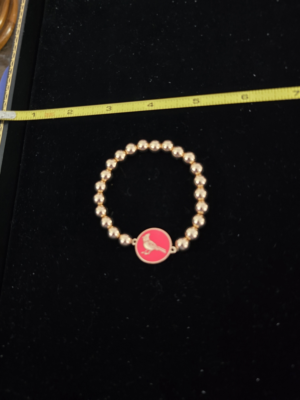 Gold Beaded Bracelet with Pink Bird Charm